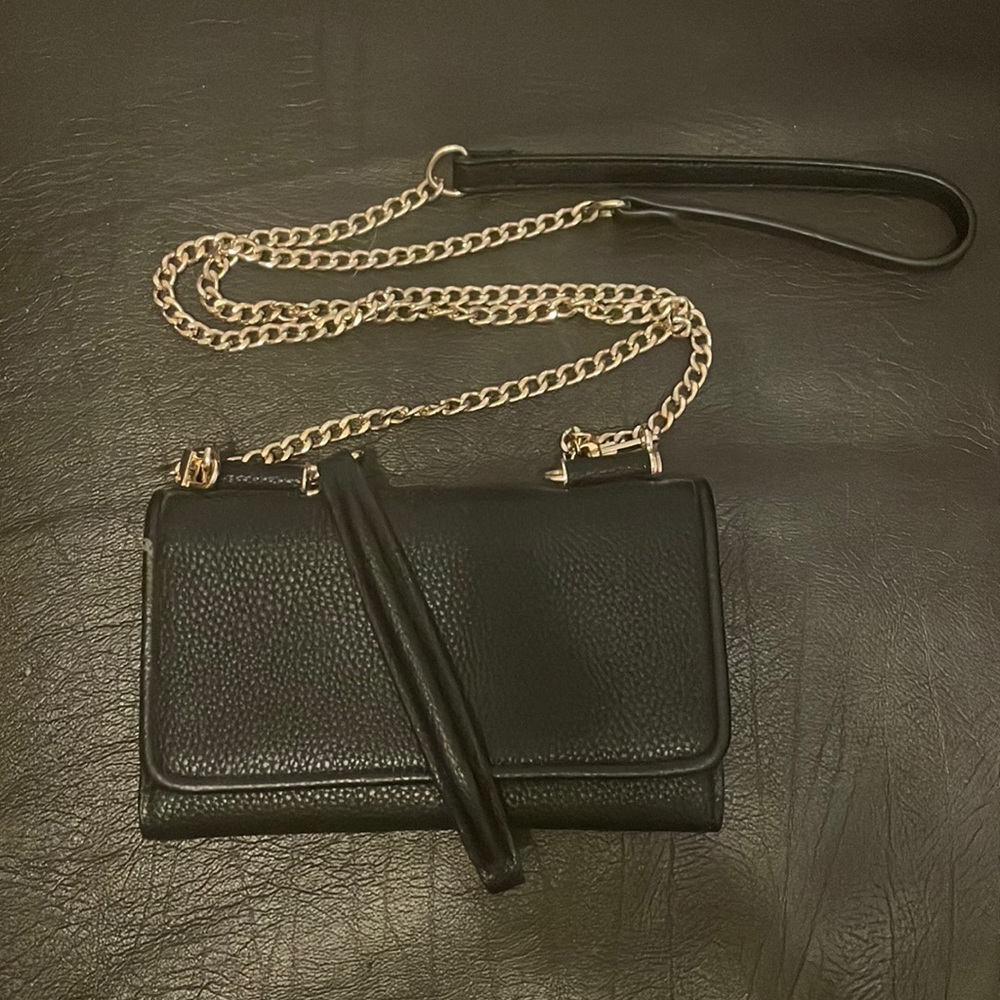 Black clutch with gold chain strap